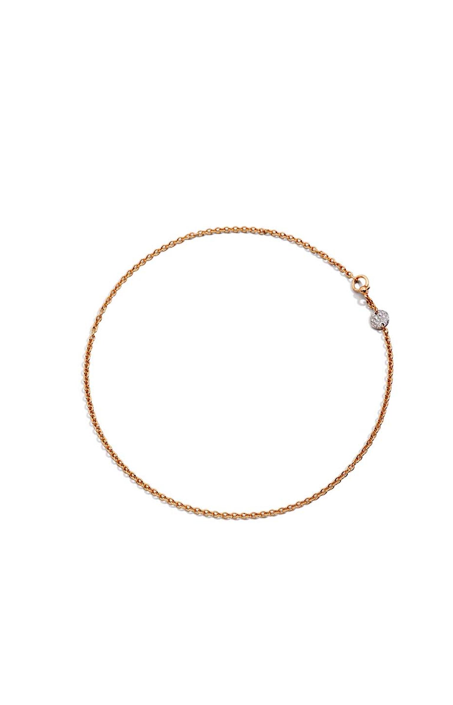 Pomellato Sabbia choker necklace featuring a rose gold disc set with white diamonds.