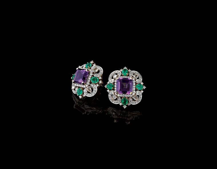 Farah Khan for Tanishq amethyst stud earrings surrounded with emeralds and diamonds set in yellow gold.