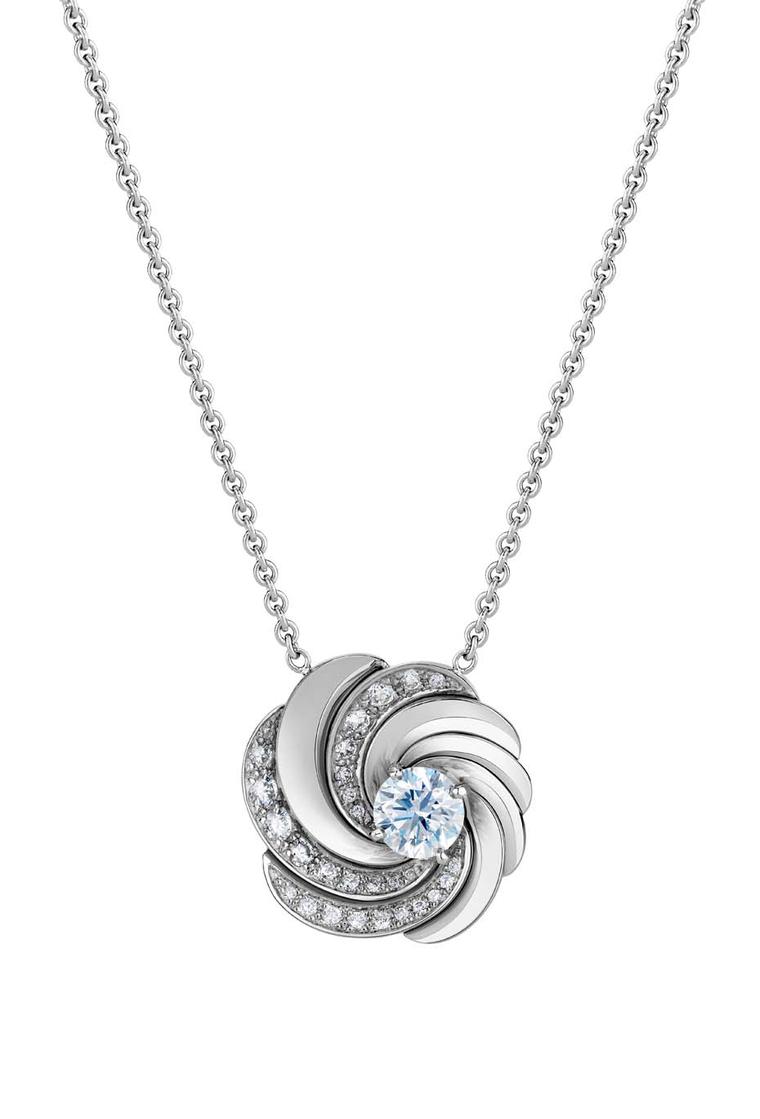 De Beers Aria necklace featuring a round brilliant diamond sitting at the centre of swirling ribbons of white gold and diamond pavé (£8,750).