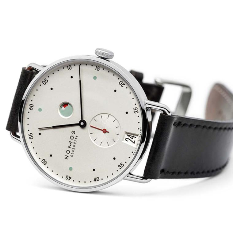 With a minimalist Bauhaus aesthetic, the dial of this Nomos Metro watch, with its date window, power reserve and small seconds counter, incorporates touches of colour to great effect (£2,390).