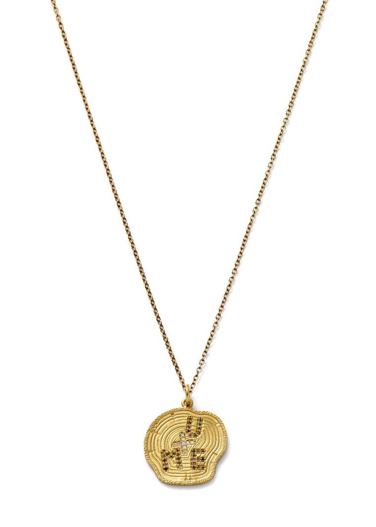 Alison Lou gold U + ME Tree Carving necklace featuring a pavé-set champagne diamond 'U' and 'ME', and pavé white diamond '+'. Available from Latest Revival ($2,490).