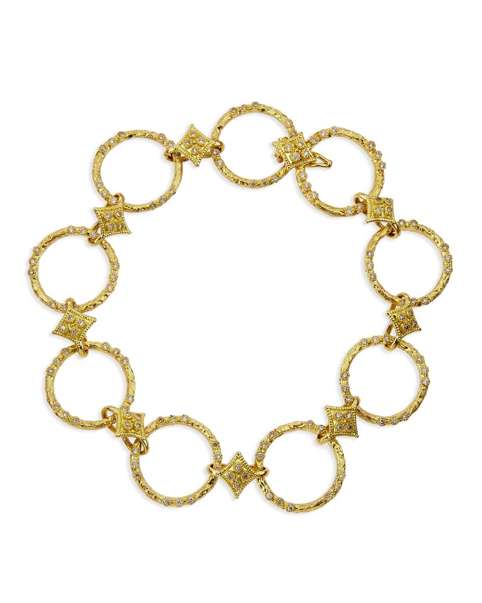 Armenta yellow gold bracelet with textured circle links and quatrefoil stations with pavé white diamonds. Available from Bergdorf Goodman ($4,790).
