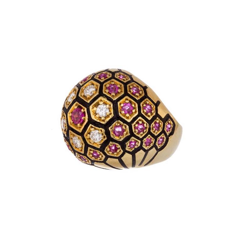 Broken English vintage domed yellow gold ring with white diamonds, rubies and black enamel ($7,600).
