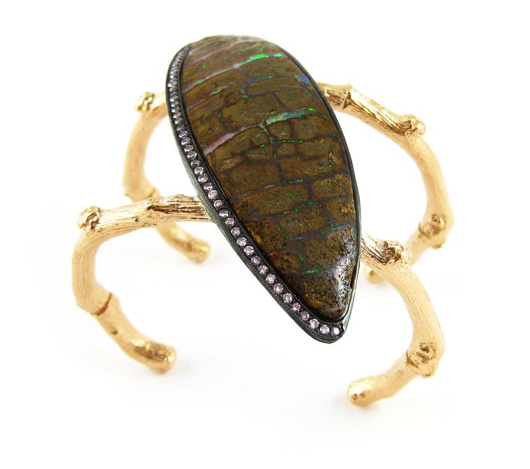 K. Brunini Twig cuff featuring a rainbow-flecked opal that wraps around the wrist on two organically shaped gold bands in Brunini's signature twig style.
