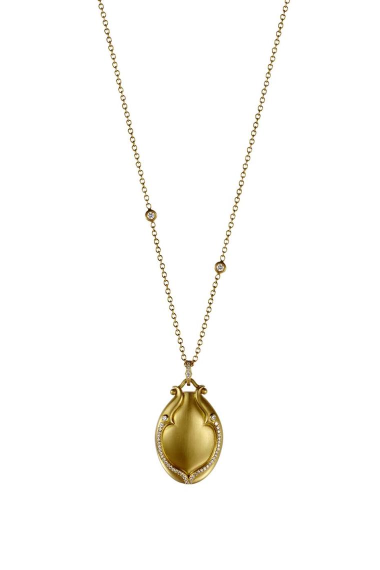 Anahita Lovebird brushed-gold locket with pavé white diamonds and a bezel-set chain ($9,000).