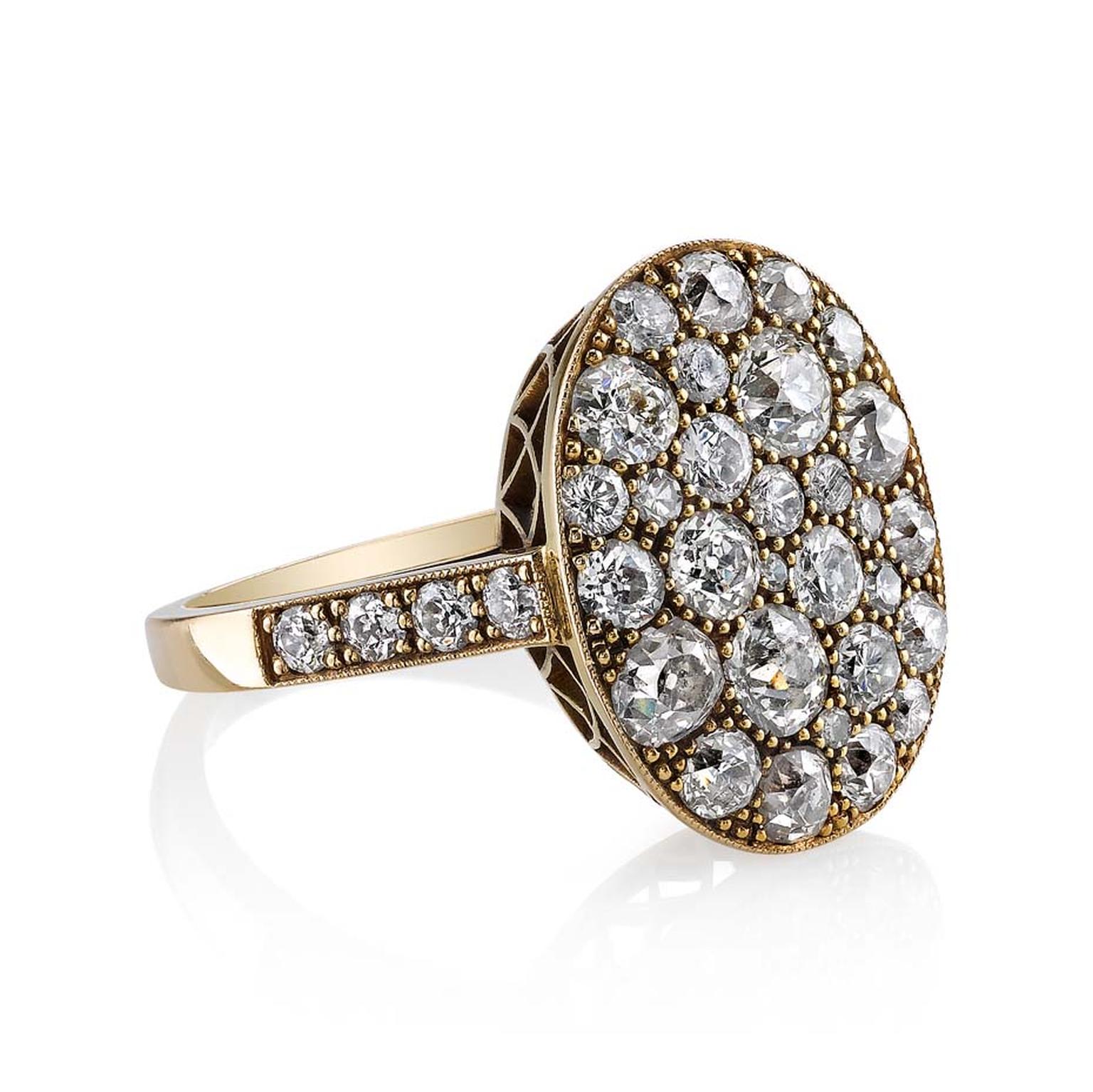 Single Stone small oval cobblestone ring set with pavé diamonds ($8,000).