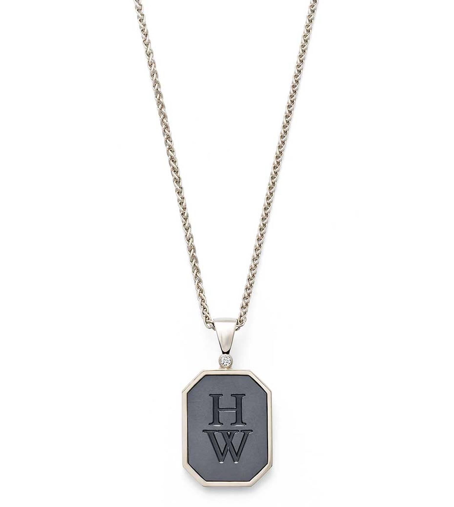 Harry Winston Zalium HW Logo pendant in white gold and Zalium, set with a round-brilliant diamond.