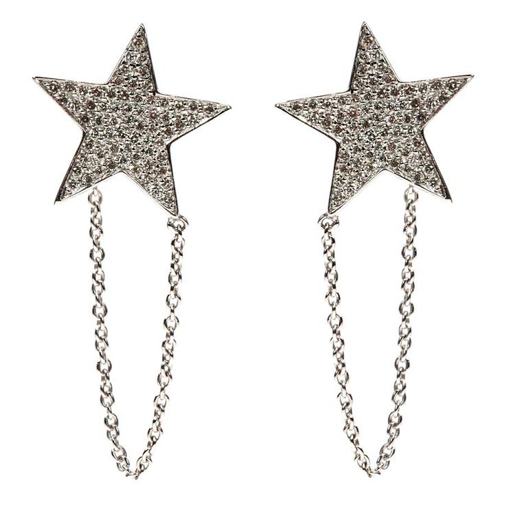 Nikos Koulis Star earrings in white gold encrusted with white diamonds can be worn in the traditional way on the ear lobe or positioned higher up on the ear.