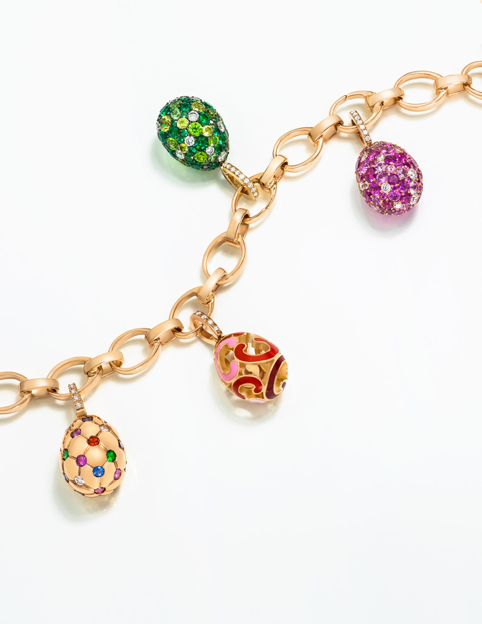 Fabergé's Egg Charms reference moments in Fabergé's history, including the Treillage egg, left, with its quilted pattern of gold dimpled with precious gemstones, which is a miniature interpretation of the 1892 Imperial Easter Egg.