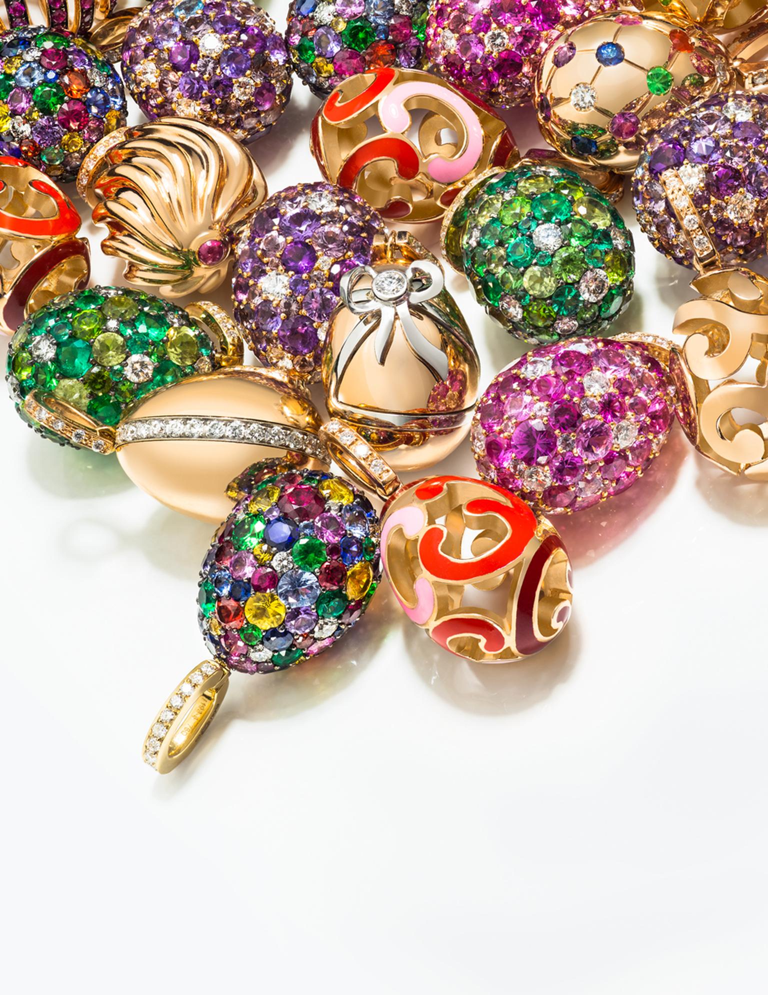 Fabergé's playful new Egg Charms, which can be fastened to a bracelet or worn on a chain around the neck, are punctuated with candy-bright gemstones, deeply ridged golden swirls or lustrous enamel.