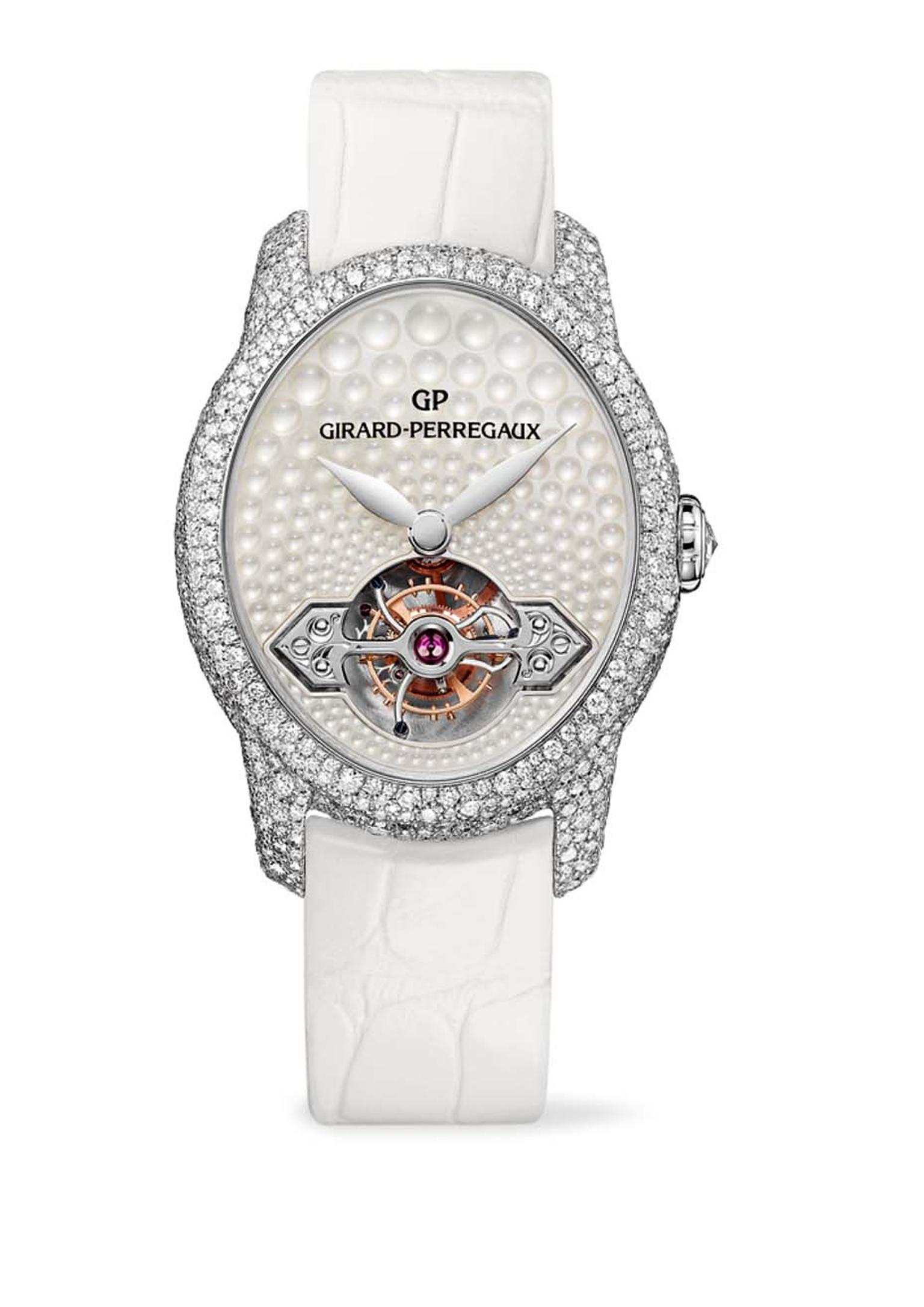 Girard-Perregaux Cat’s Eye Jewellery watch glitters with over 1,000 snow-set diamonds on the white gold case, which houses a unique mother-of-pearl dial with light-reflecting bubbles across its entire surface.