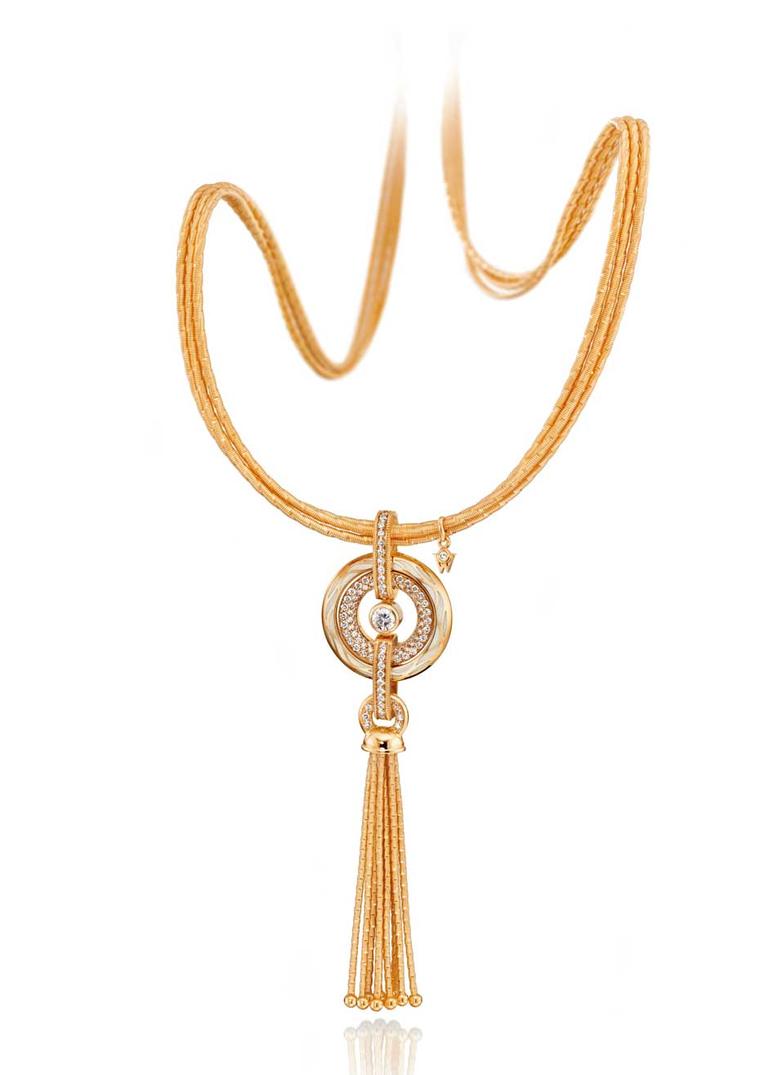 Wellendorff Genuine Delight gold amulet necklace with diamonds and mother-of-pearl. A single rope necklace requires around 160m of gold threads to complete.
