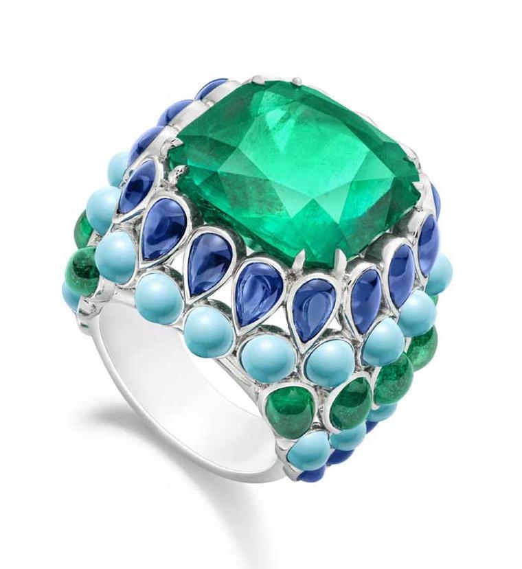 Extremely Piaget ring with a 17.48ct cushion-cut emerald in platinum set with cabochon-cut turquoises, sapphires and emeralds.