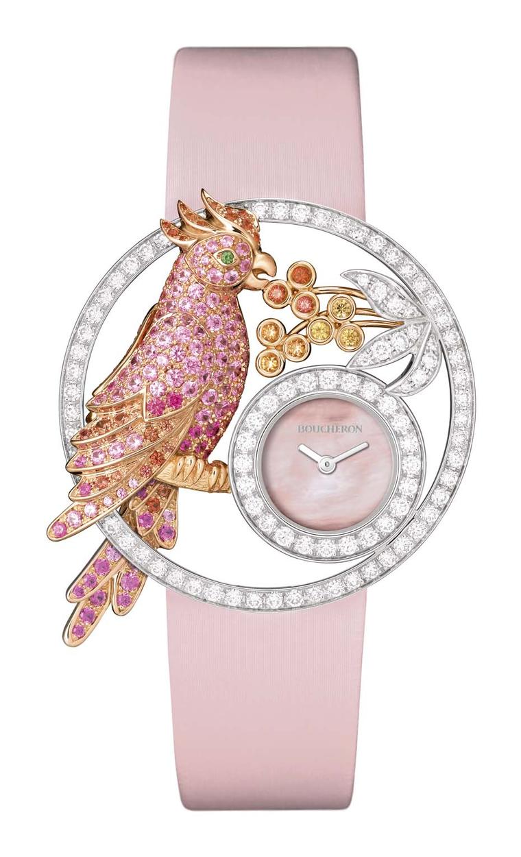 Boucheron Ajourée Nuri watch features a pretty parrot perched on a branch nibbling tropical fruit. Swathed in diamonds and orange-pink sapphires and with a pink mother-of-pearl dial, the parrot sparkles with life.