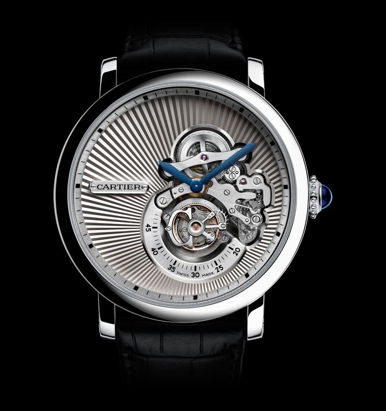The Rotonde de Cartier Reversed Tourbillon Watch is an artistic, unconventional and extremely beautiful watch crafted in white gold. The sunray guilloché pleats of white gold that draw the eye in to the action are almost like the pleats on a stiffly starc