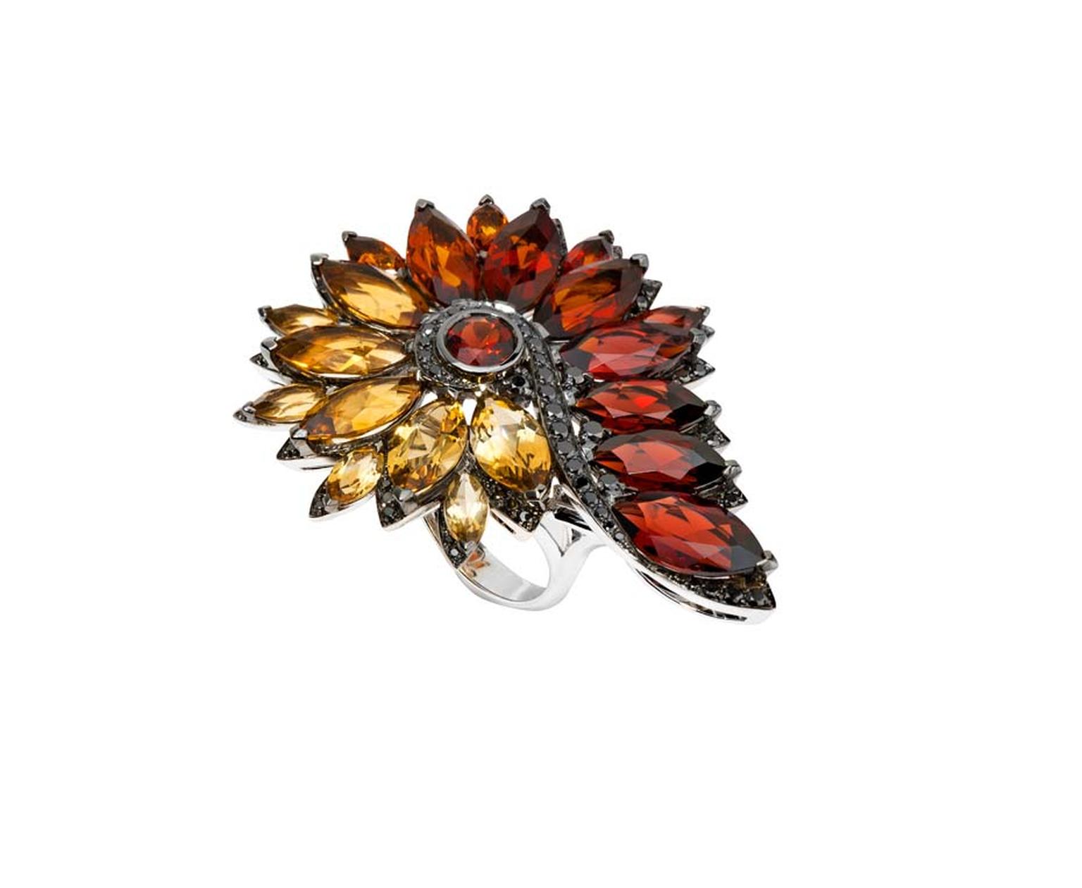 Stephen Webster Albion Rose Magnipheasant ring set with pyrope garnets and citrines.