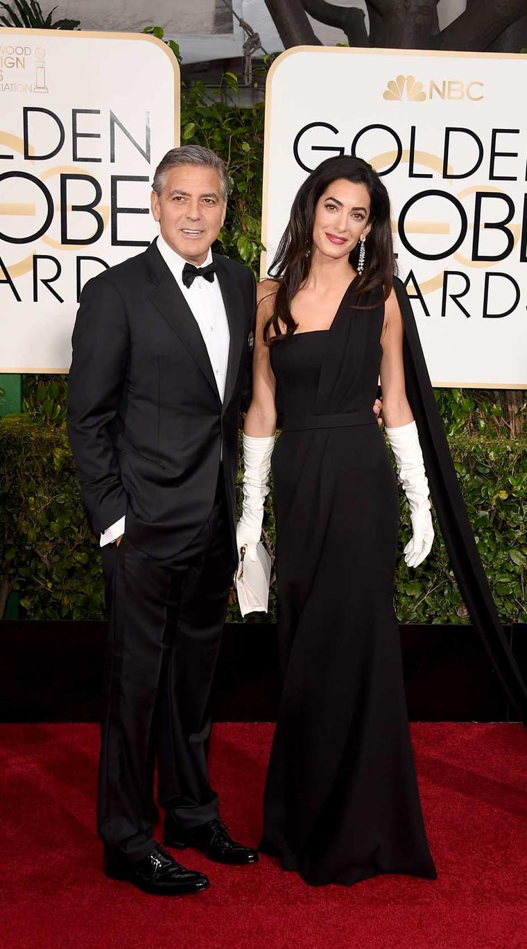 Amal Clooney appeared on the red carpet alongside her husband George wearing Harry Winston Cascading Deel Diamond Drop Earrings, set in platinum.