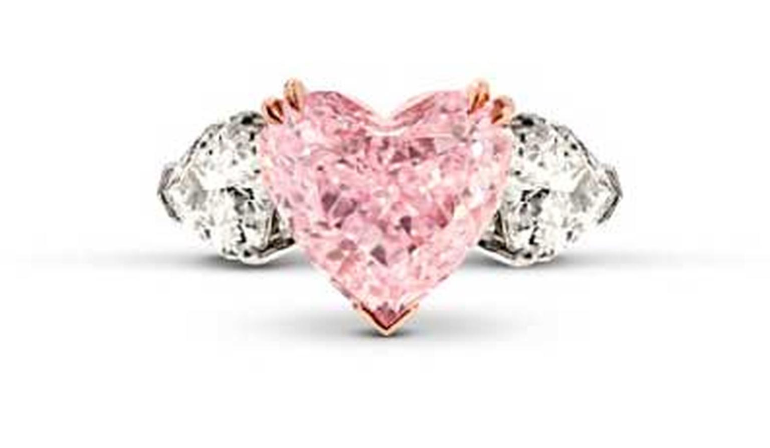 Star Diamond pink diamond engagement ring, set with a 5.32ct heart-shaped Intense pink diamond, flanked on either side by white diamonds.