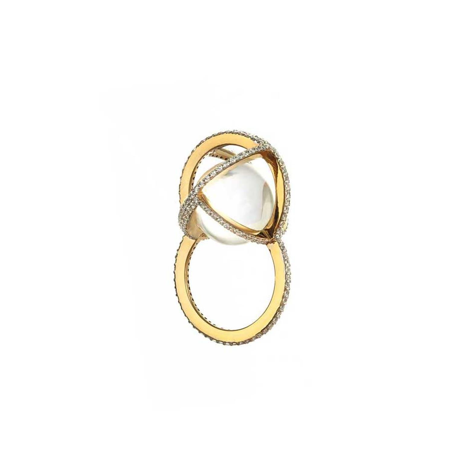 Lara Bohinc's Planetaria ring - a nod to Copernicus' astronomical model - features a gold frame surrounding a translucent rock quartz.