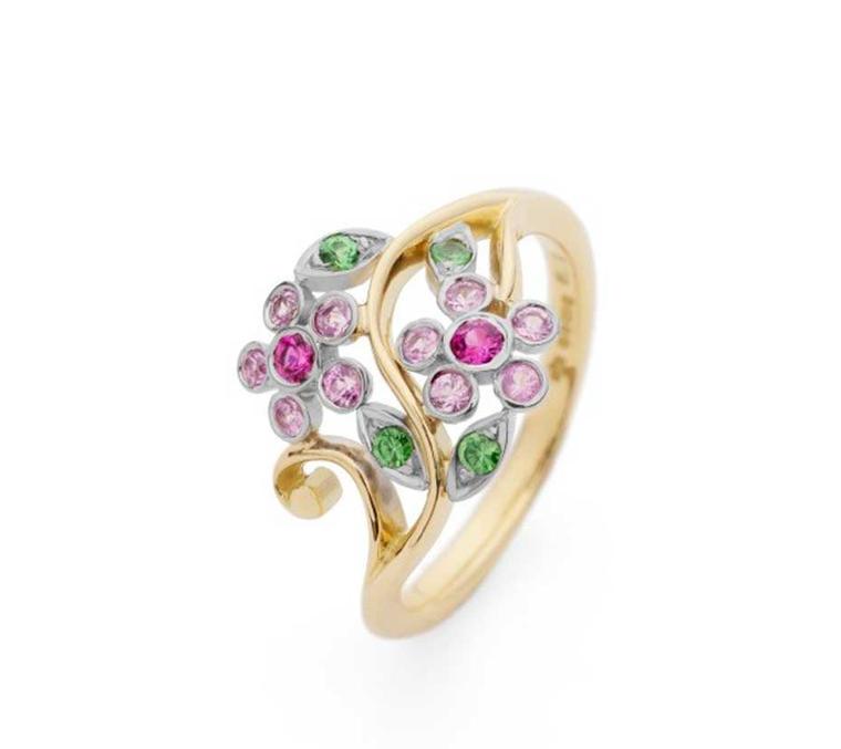 Erica Sharpe Single Flower engagement ring Fairtrade gold with pink sapphires and tsavorite garnets.