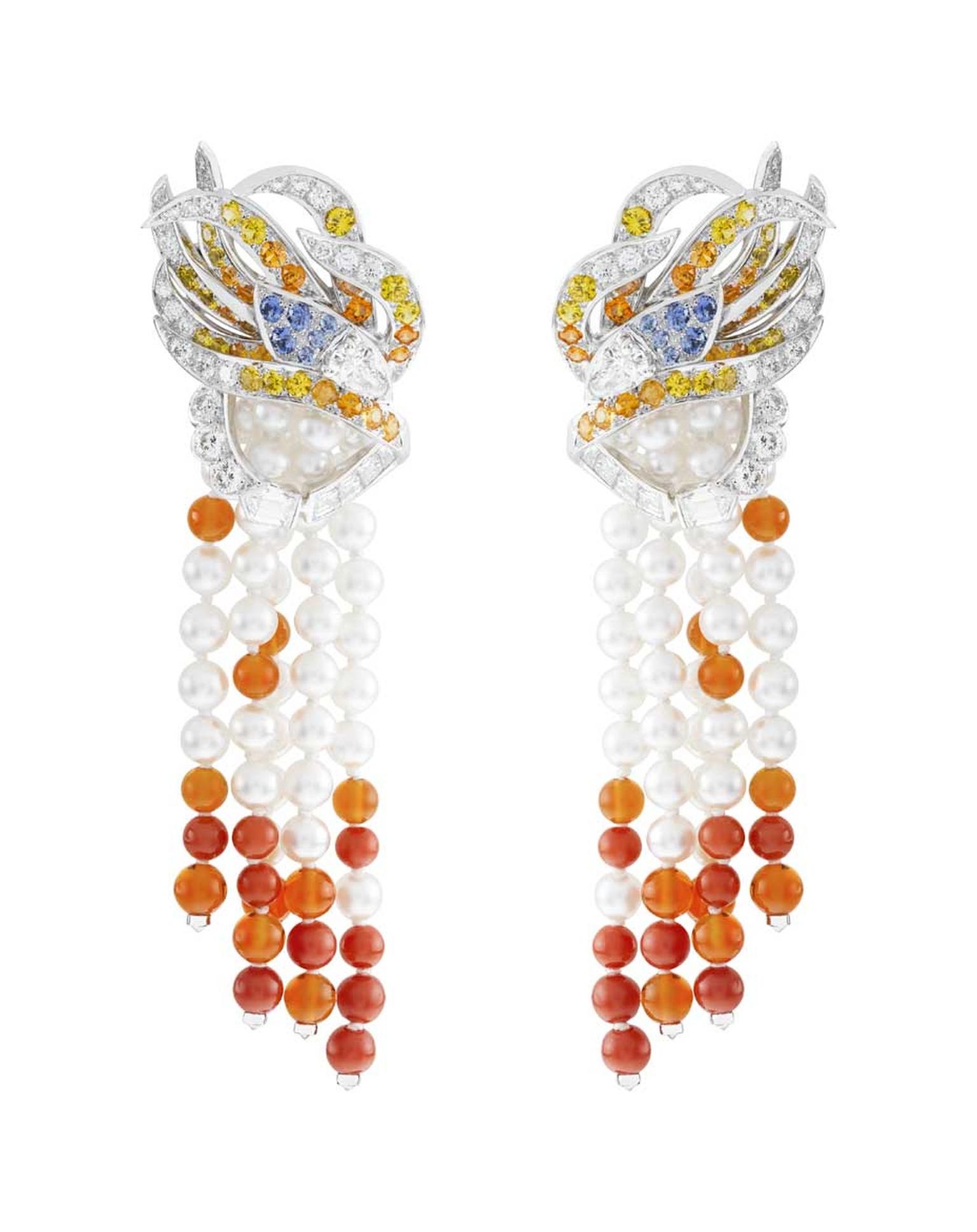 The stunning Oiseau de Feu earrings from the Palais de la Chance collection by Van Cleef & Arpels worn by Viola Davis, featuring diamonds, spessartite garnets, fire opal, red coral, white cultured pearls, blue and yellow sapphires set in white gold.