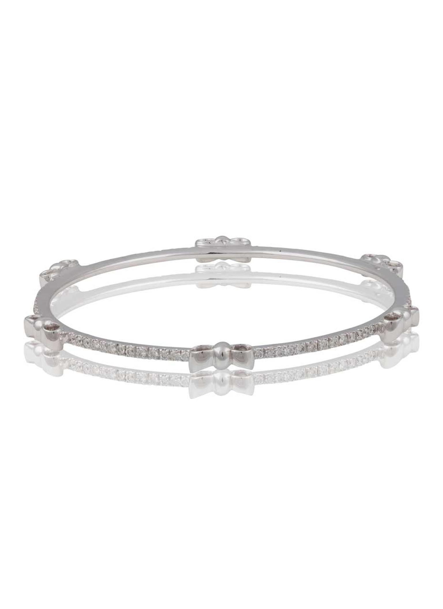 Mirari bangle in white gold with diamonds.