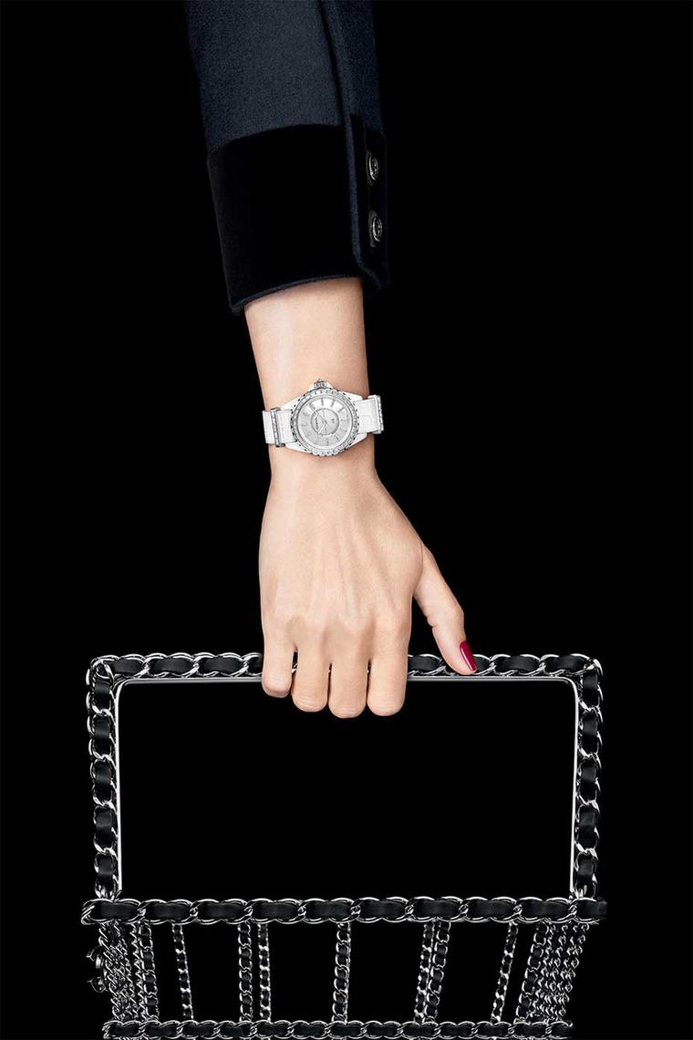 Chanel J12-G10 watch in a 33mm white high-tech ceramic and white gold case with a mother-of-pearl dial and baguette-cut indices. The white gold bezel is set with 34 diamonds and a brilliant-cut diamond is set in the crown. The strap keepers and gold pin b