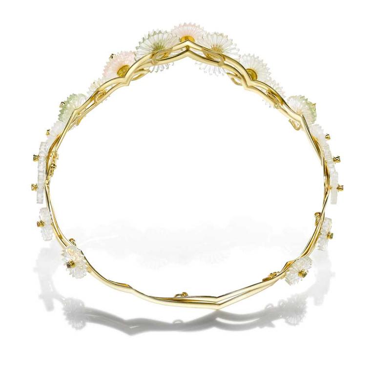 This tiara from the new Alice Ciccolini Summer Snow collection features carved disks made to resemble a cascade of delicate flowers set on gold, crafted to look like bamboo branches.