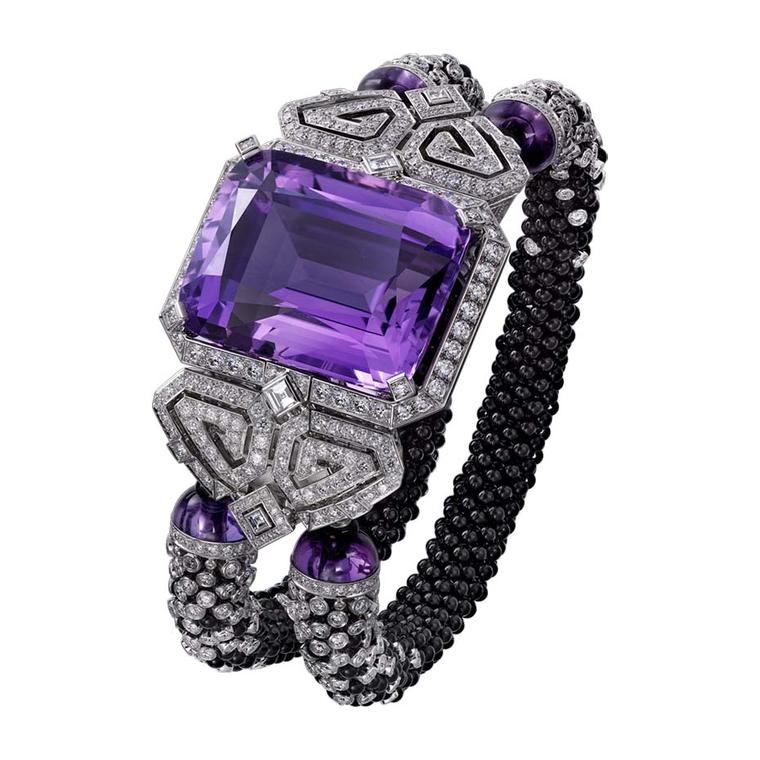 Cartier Purple high jewellery secret watch has two curved scrolls set with onyx and diamonds, which sustain the two diamond and onyx beaded bracelets.