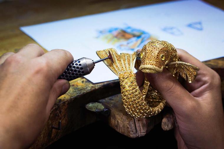 A jeweller polishing the Carpe Koï's tail at the Van Cleef & Arpels ateliers situated on Place Vendôme, Paris.