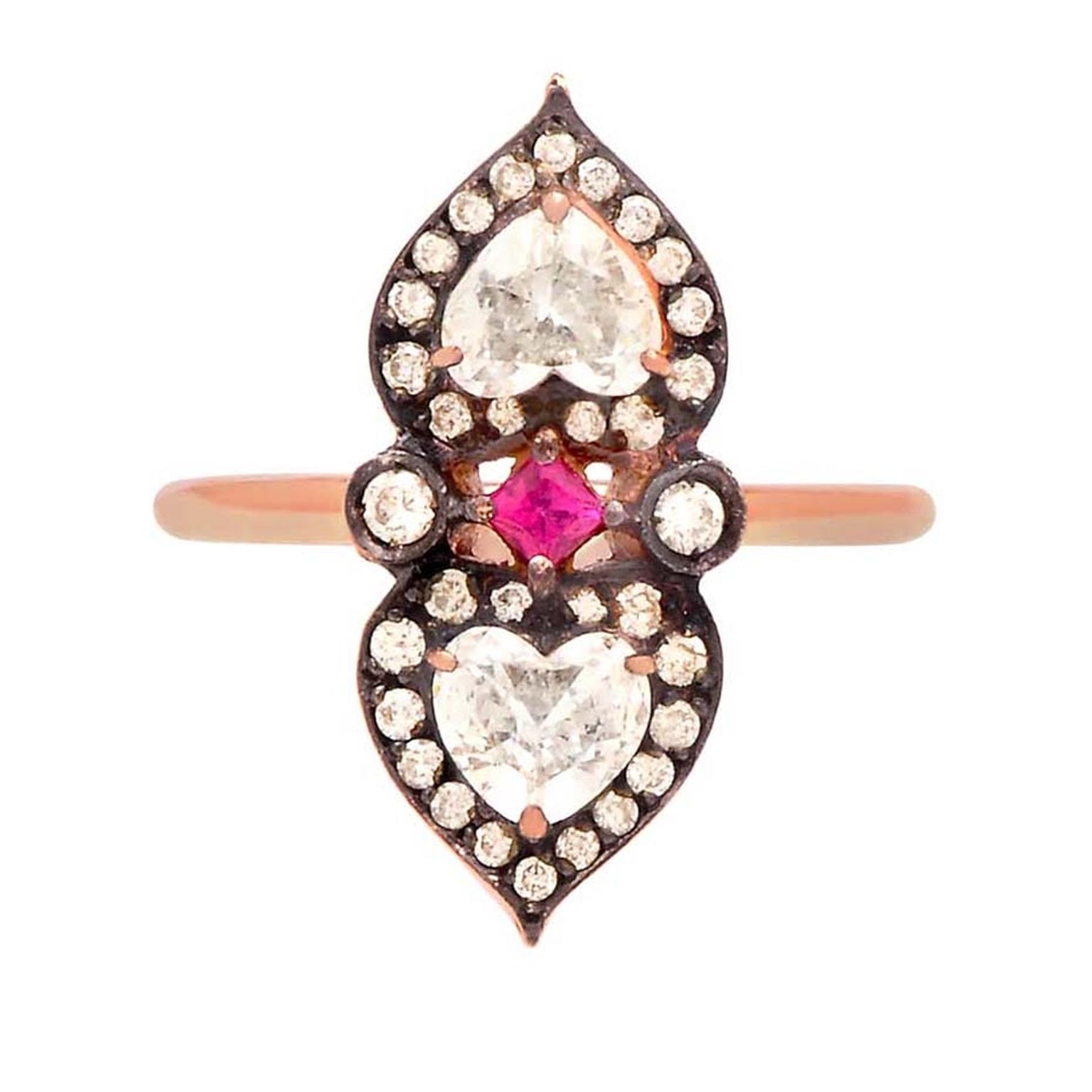 Sabine G's unusual heart-shaped diamond, ruby and rose gold ring from the Relic collection. This handmade engagement ring features two heart-shaped white diamonds set in heart-shaped, diamond-set, rose gold.