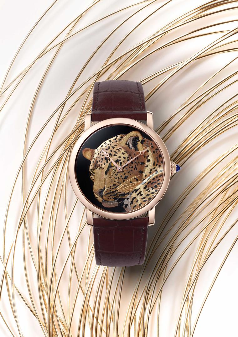 Rotonde de Cartier 42mm rose gold watch features a solitary panther brought to life thanks to the art of damascening in which different colours of gold wire are hammered into the spaces cut into the gold dial to create the feline's supple golden coat. (Ni