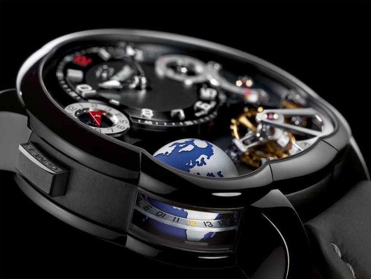 Greubel Forsey GMT is housed in a lightweight titanium case with a black ADLC coating. The 3D globe completes a rotation every 24 hours and gets extra light from the lateral window on the case. The inclined 24-second tourbillon is a house speciality.