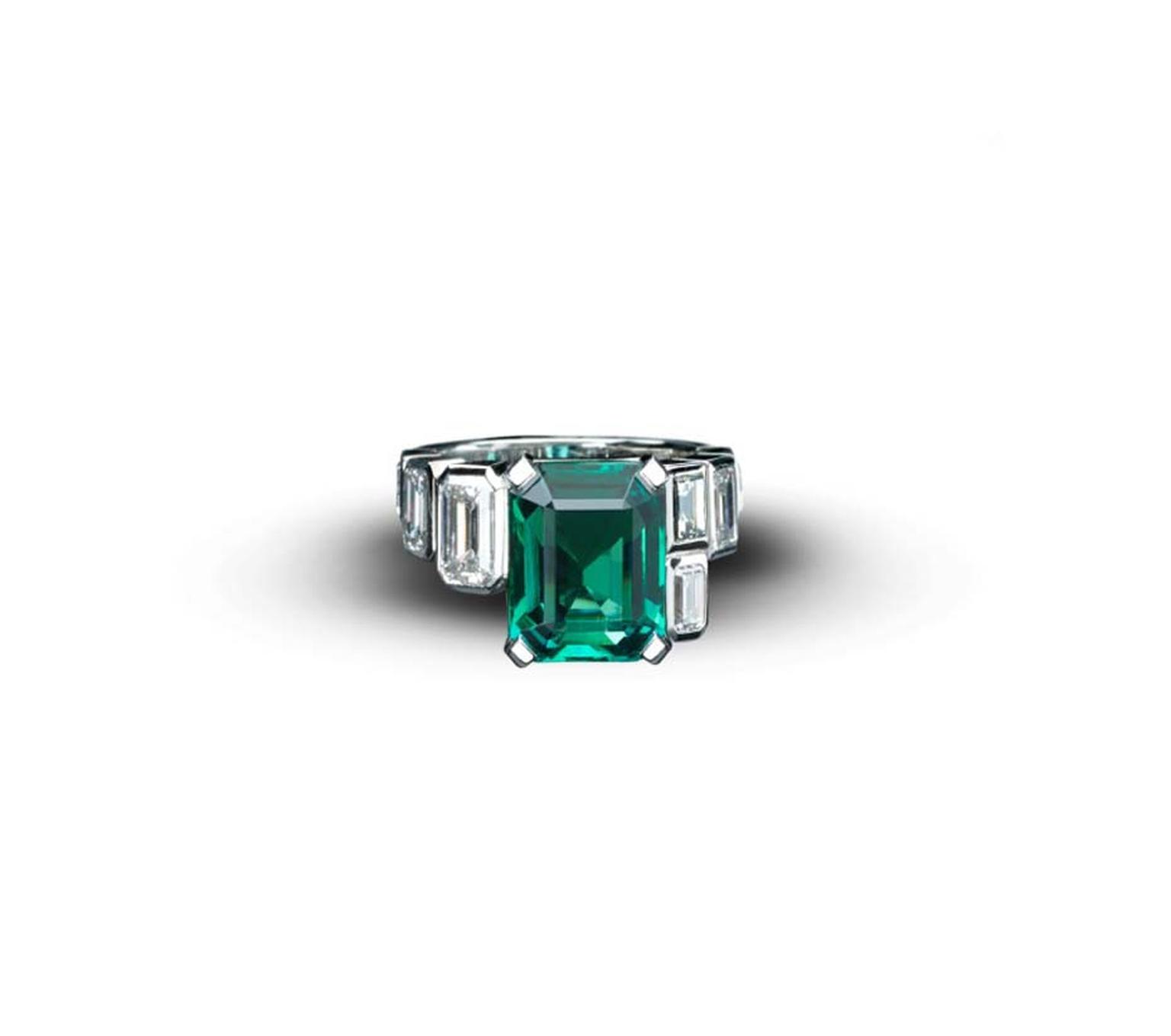 Emerald Art Deco Style ring from Star Diamond, with a central African emerald, weighing 5.9cts, flanked with white emerald cut diamonds of 2.73cts set in white gold.