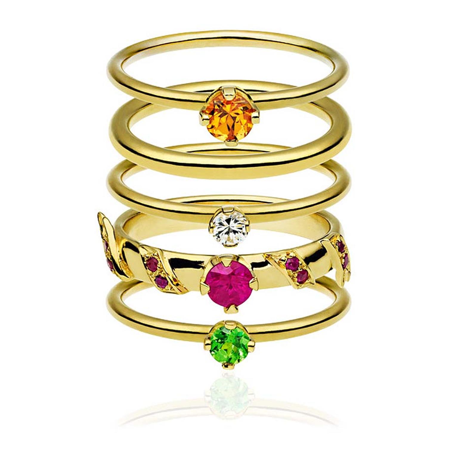 Ana de Costa Alchemy gemstone stacking rings in yellow gold featuring a round brilliant-cut mandarin garnet, a brilliant-cut diamond, brilliant-cut rubies and a brilliant-cut tsavorite,£2,950.