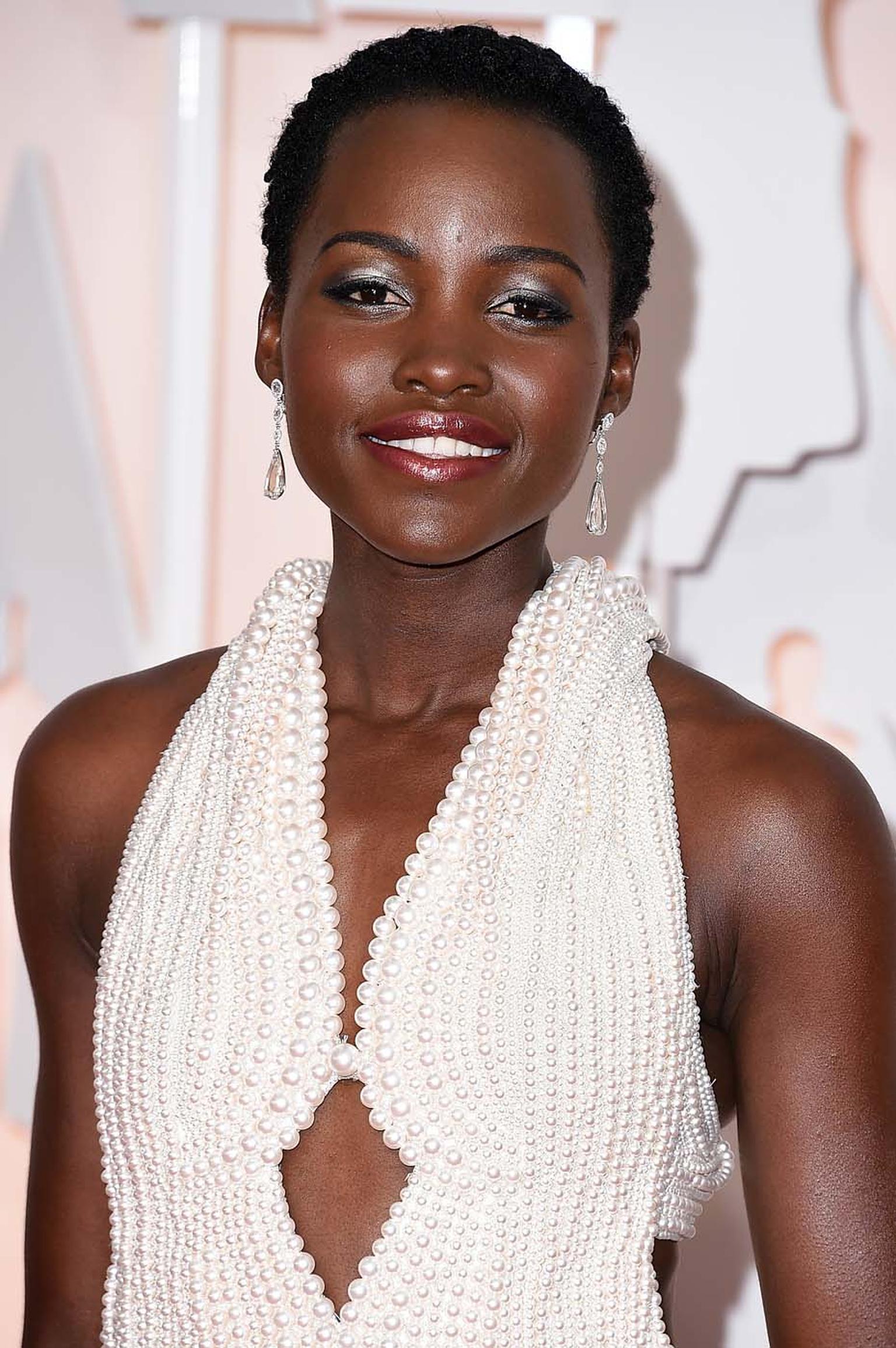 Actress Lupita Nyong’o walked the Oscars red carpet wearing a pair of Chopard diamond earrings featuring pear-shaped and rose-cut diamonds and three Chopard diamond rings, which added extra sparkle to her pearl-embellished Calvin Klein dress.