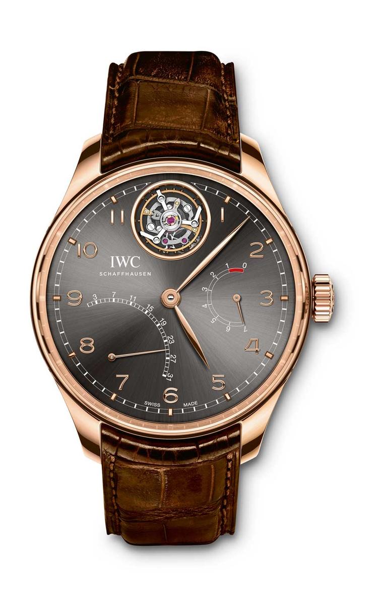 IWC Portugieser Tourbillon Mystère Rétrograde watch features a flying tourbillon at 12 o'clock floating in mid-air and a retrograde date display. The slate-coloured dial is offset by the warm 42.2mm rose gold case.