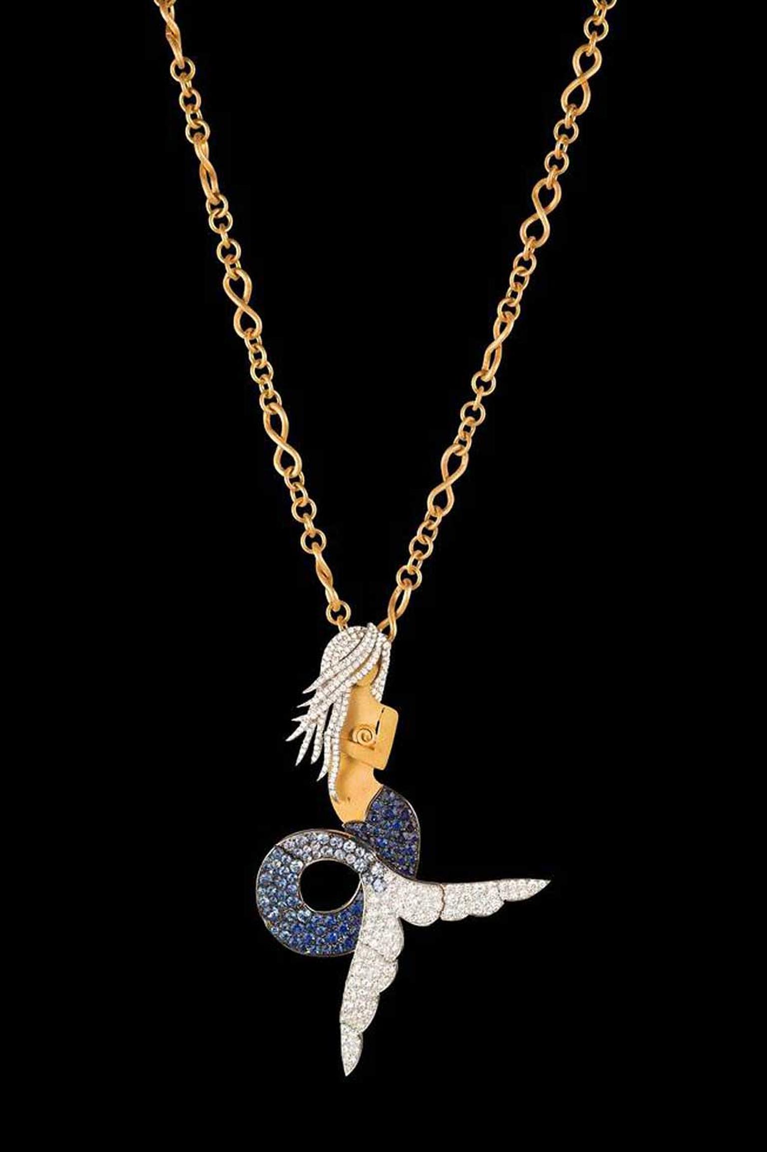 Liv Ballard s La Sirena The Siren necklace on a yellow and