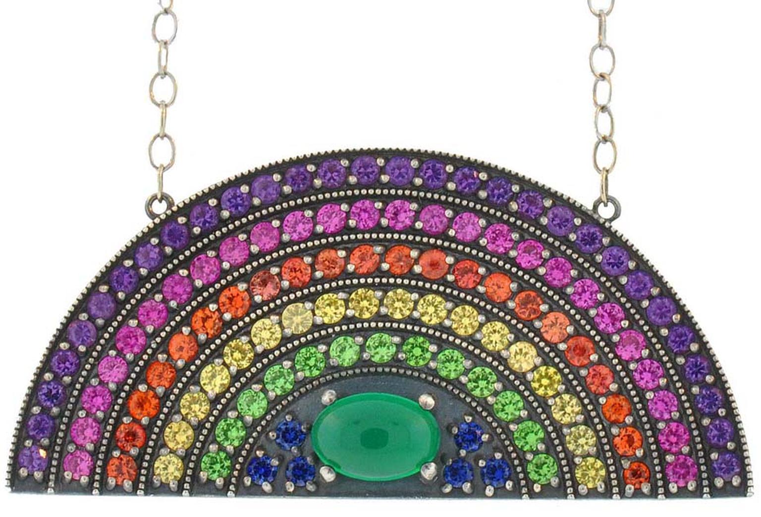 Andrea Fohrman rainbow pendant with stripes of coloured stones arched over a cabochon-cut green onyx. $5,500.