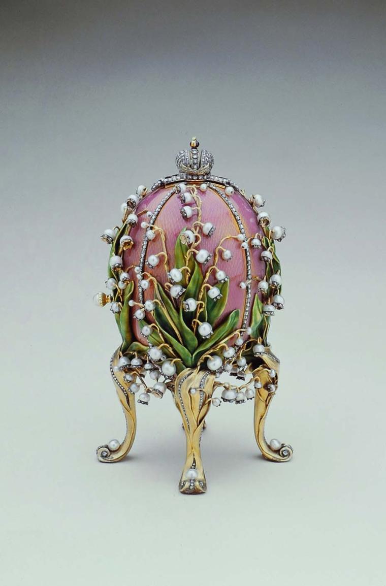 Tsar Nicholas II presented Empress Alexandra with this Fabergé Lilies of the Valley Egg. Made of gold, overlaid with translucent rose pink enamel, the beautiful creation is decorated with enamelled green leaves and pearls, complete with rose-cut diamond d