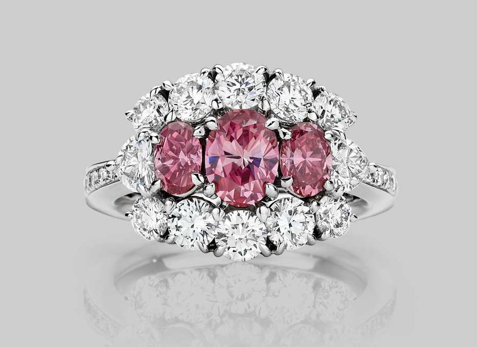 J. Farren-Price Trilogy 70th anniversary ring, with a trio of gems that feature a 0.59ct vivid purple pink, oval-cut Argyle diamond in the centre. Available at www.jfarrenprice.com.au.