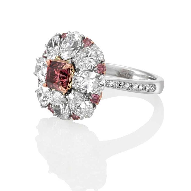 Mondial Pink Diamond Atelier Charisse pink diamond ring, set with a Vivid purple pink Argyle pink diamond in platinum and surrounded by 3.67ct oval-shaped diamonds. Available at www.mondial.com.au.