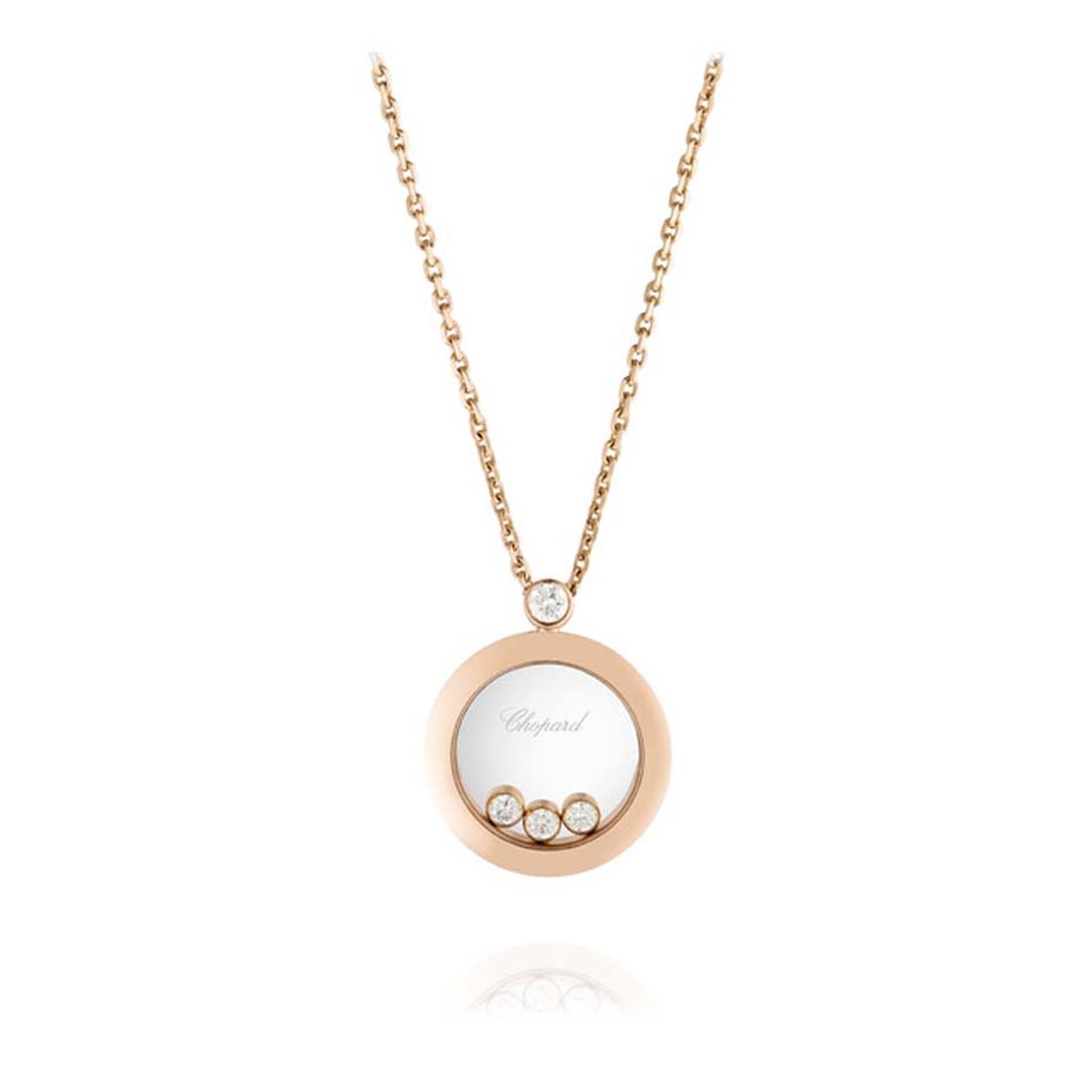 Chopard Happy Diamonds pendant, with three floating diamonds sat within a case of rose gold.