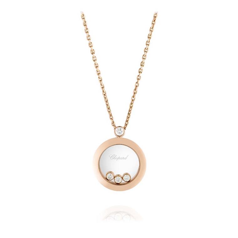 Chopard Happy Diamonds pendant, with three floating diamonds sat within a case of rose gold.