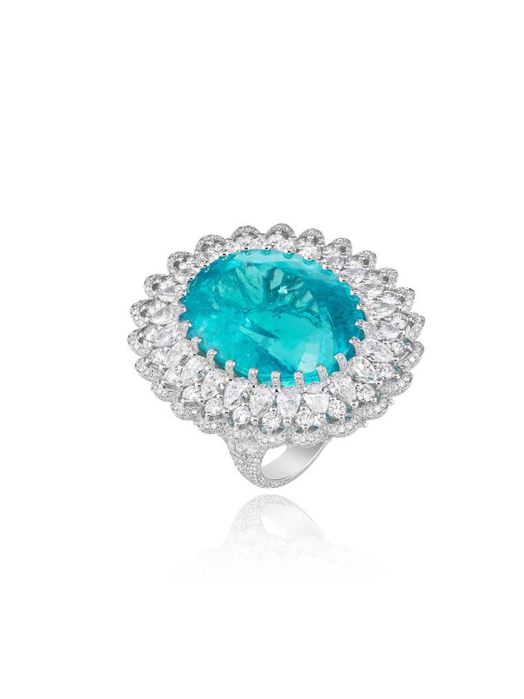 Chopard has taken advantage of the new source of Paraiba-like tourmalines from Africa to create an enormous 41.57ct oval-shaped tourmaline ring, with the lagoon-like precious stone encircled by a reef of pear-shaped and round diamonds.