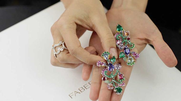 Fabergé earrings in the form of beautiful blossoms, gleaming with coloured gemstones.