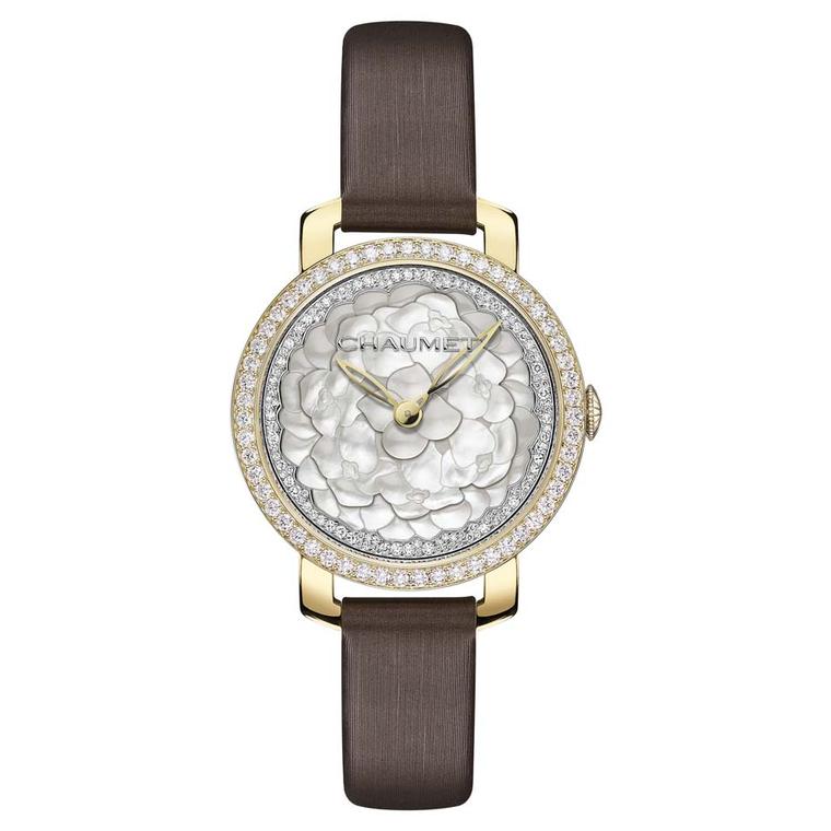 Chaumet Hortensia watch with a mother-of-pearl marquetry dial, presented in a 31mm yellow gold case with a brown satin strap.