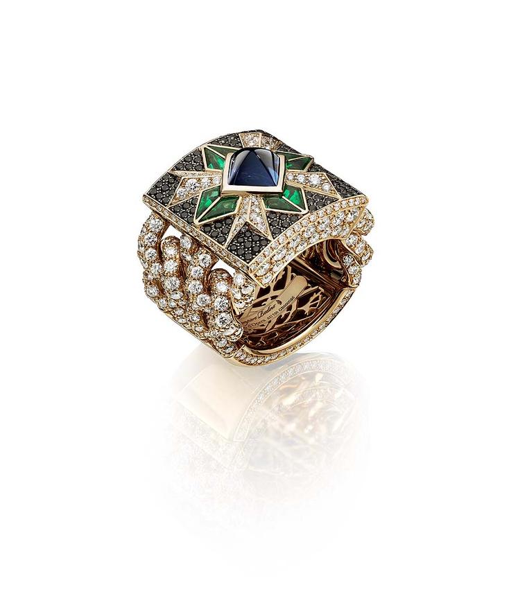 Giampiero Bodino Rosa dei Venti ring set with a central sugarloaf sapphire, emeralds and black diamonds on a diamond-encrusted chain.