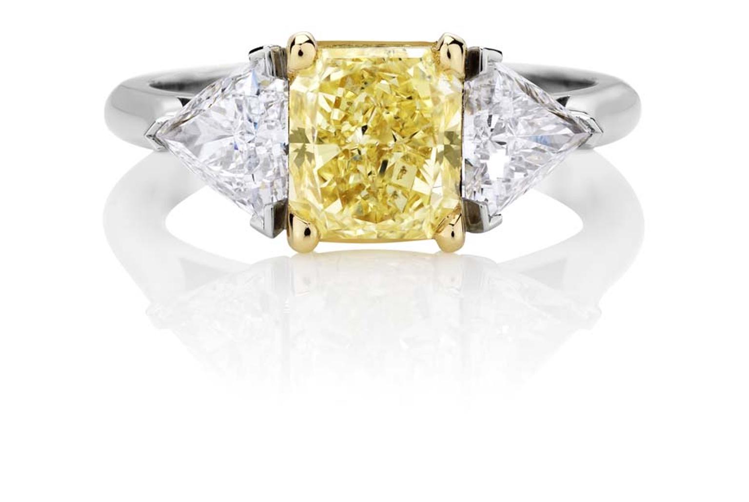 Part of De Beers jewellery’s 1888 Master Diamonds collection, a three stone engagement ring set with a 3.93ct vivid yellow diamond flanked by trilliant-cut diamonds.
