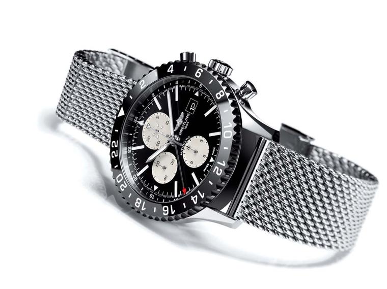 The Breitling Chronoliner watch is inspired by a model from 1950 and features a high-tech ceramic bezel with contrasting numbers, a 46mm steel case with a steel mesh bracelet, and a COSC-certified high frequency movement.